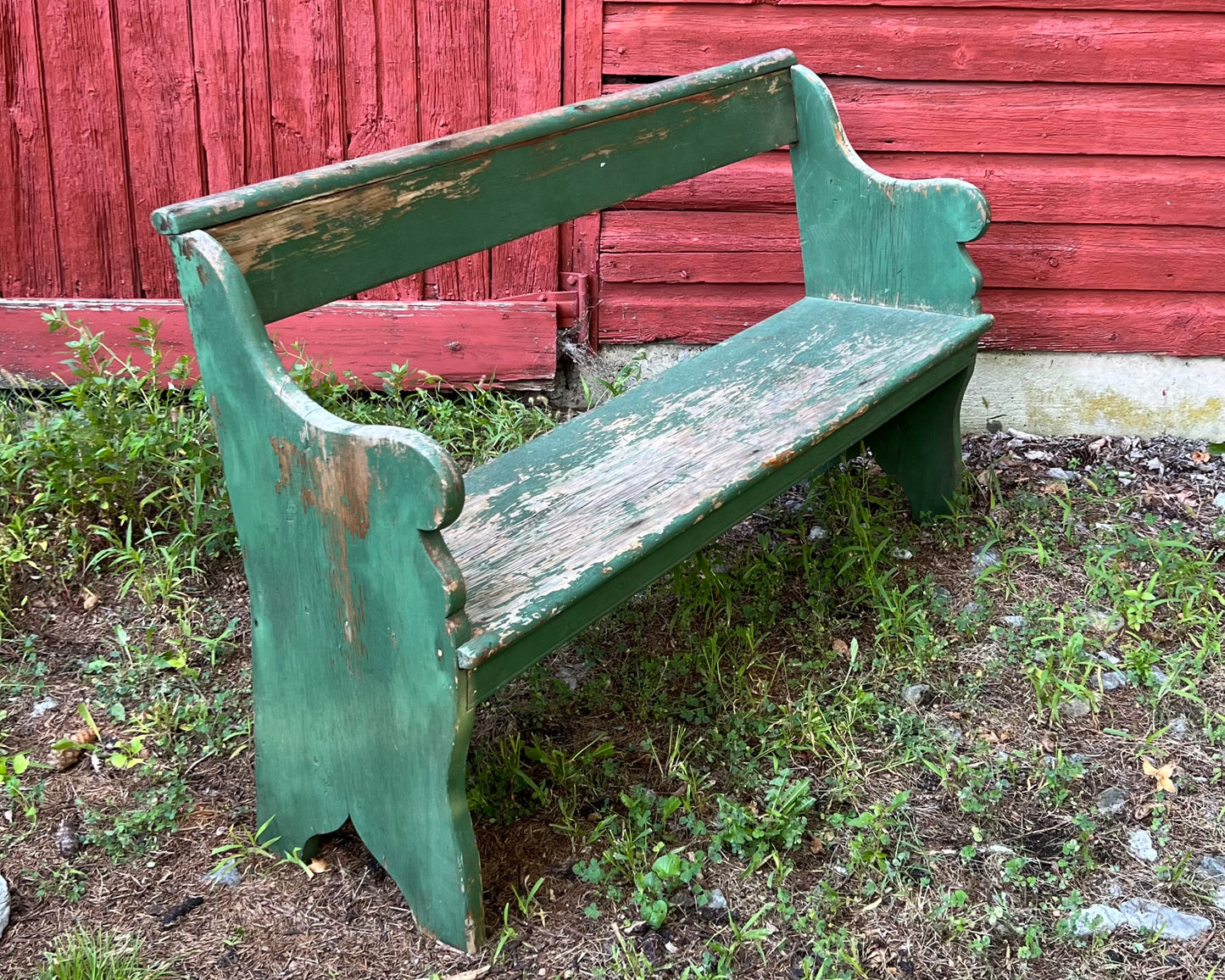 Primitive wooden bench with original green paint