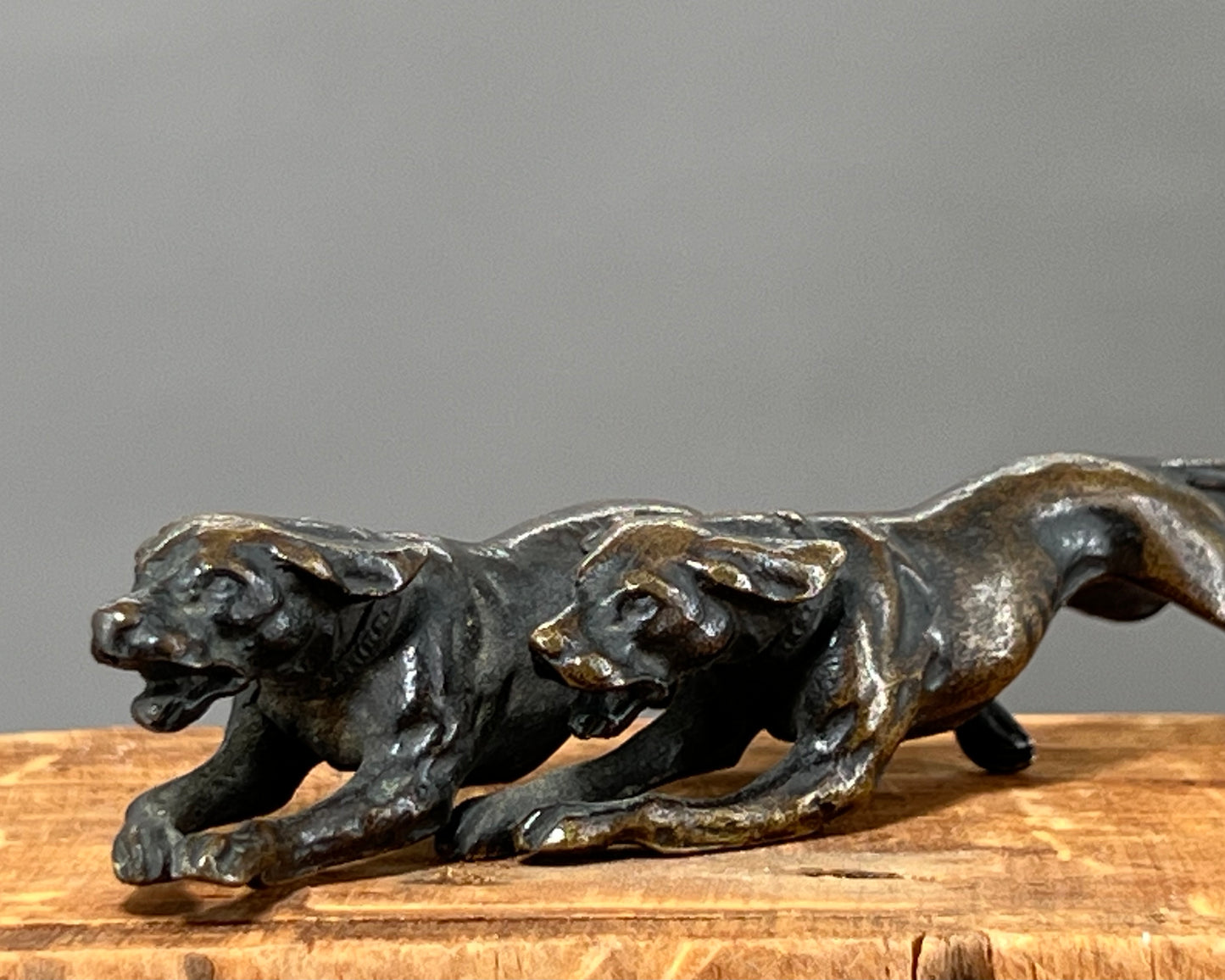 Small bronze of hunting dogs running