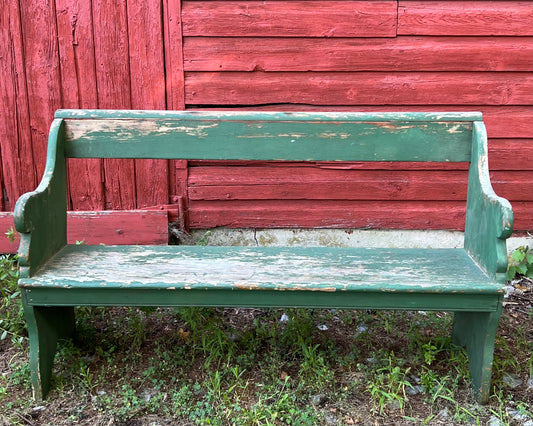 Primitive wooden bench with original green paint