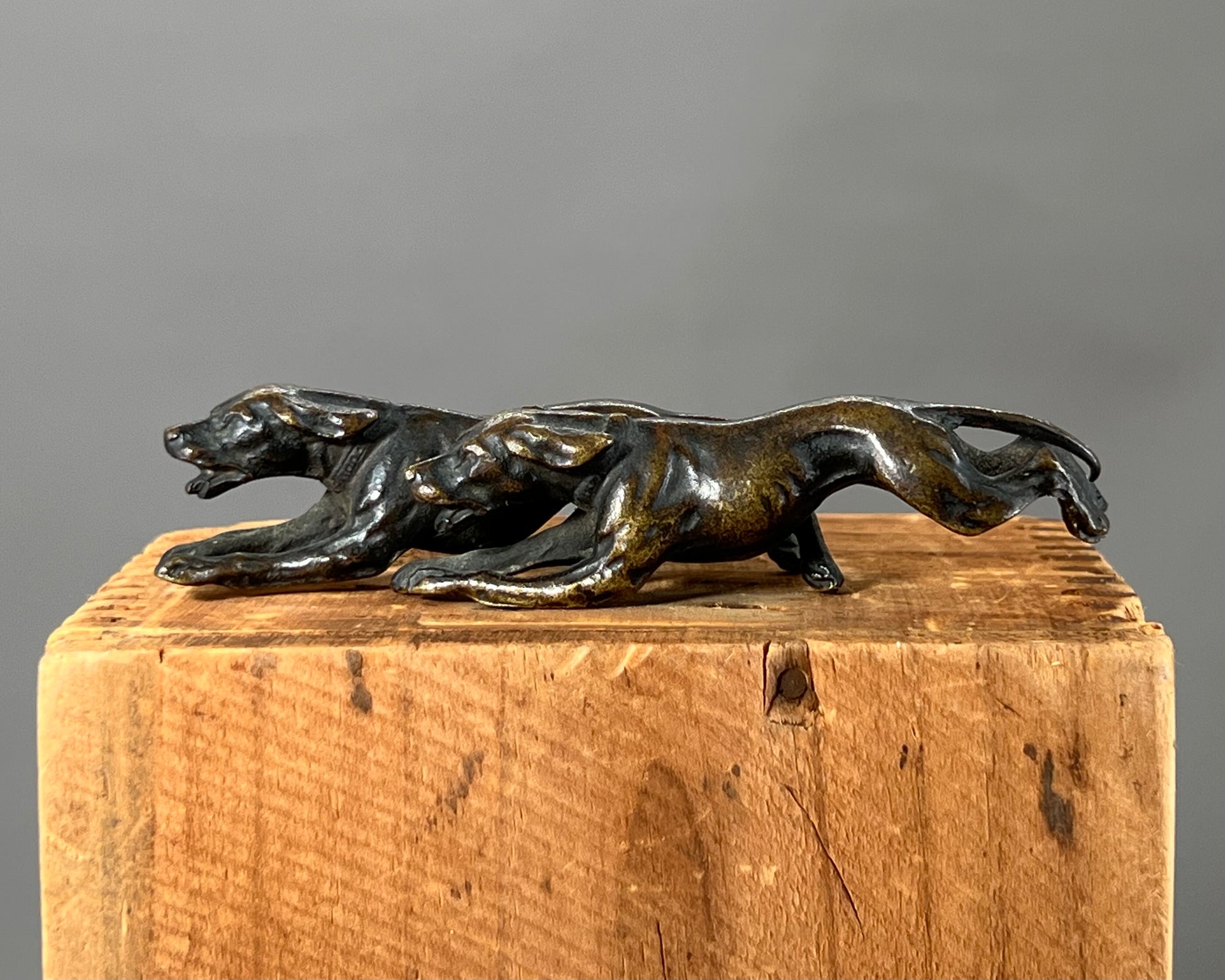 Small bronze of hunting dogs running