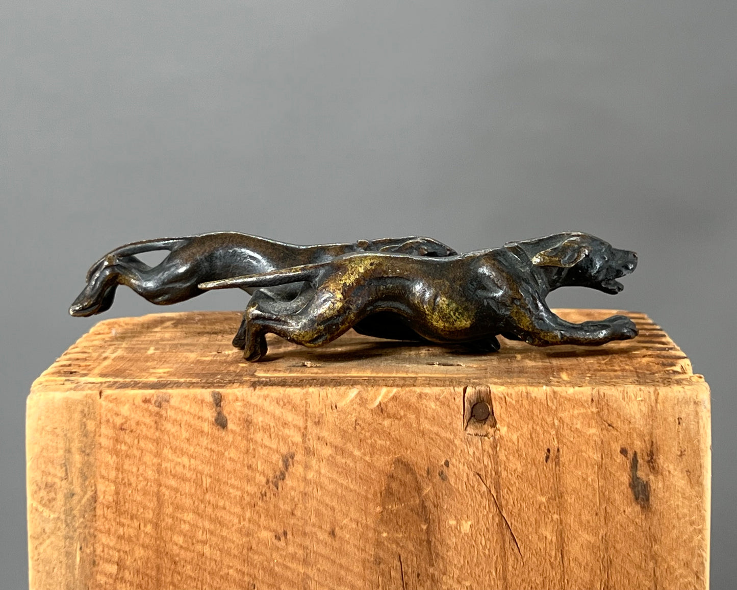 Small bronze of hunting dogs running