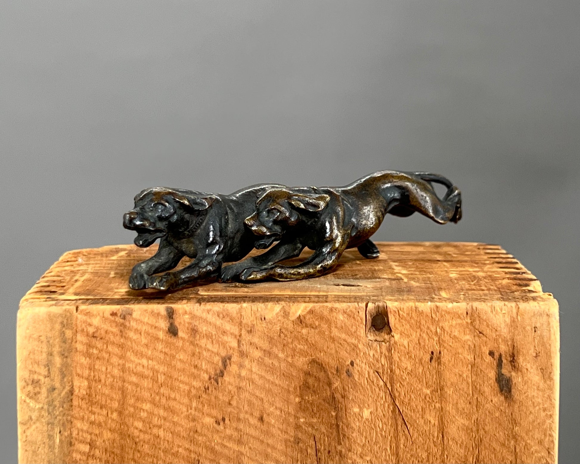 Small bronze of hunting dogs running