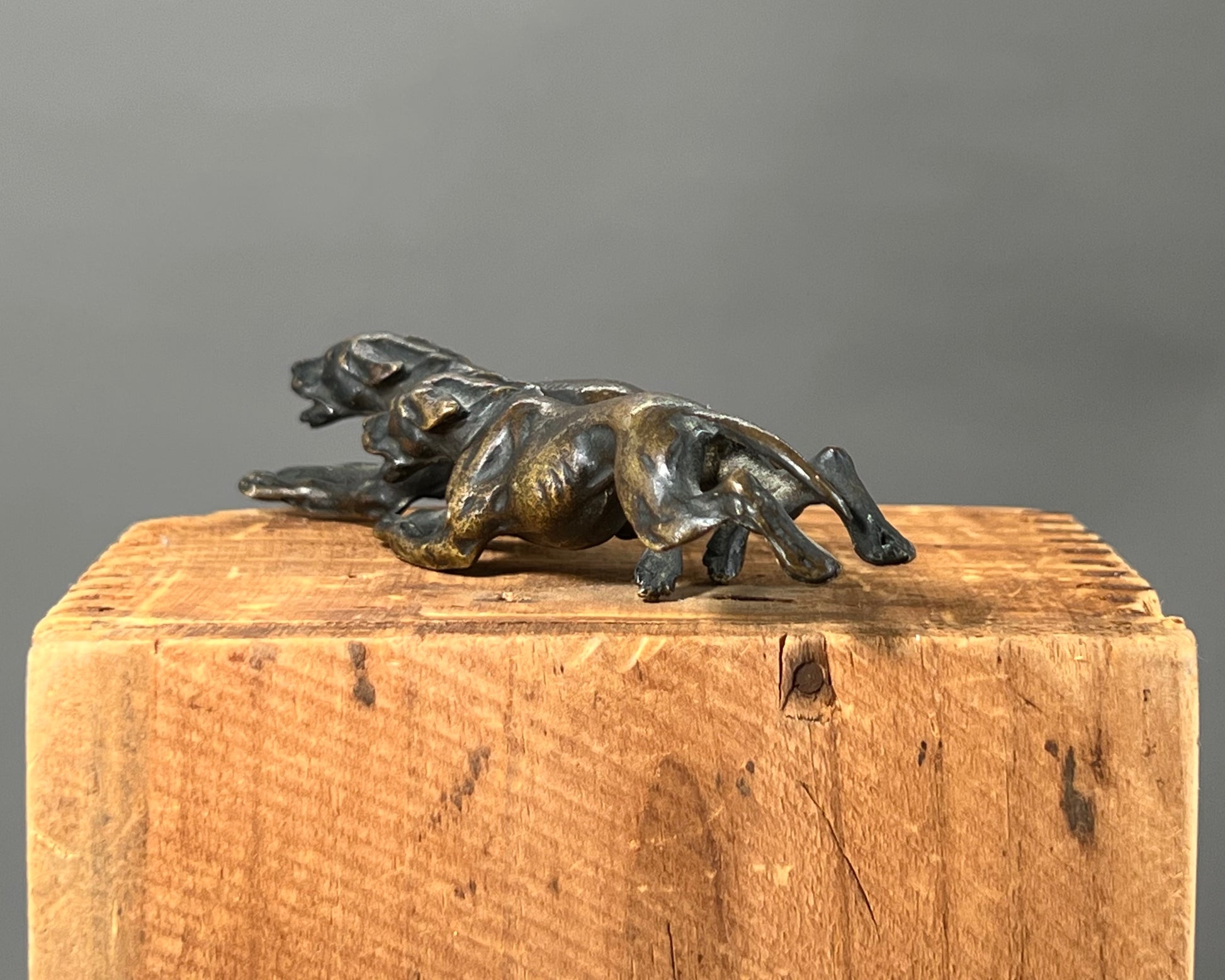 Small bronze of hunting dogs running